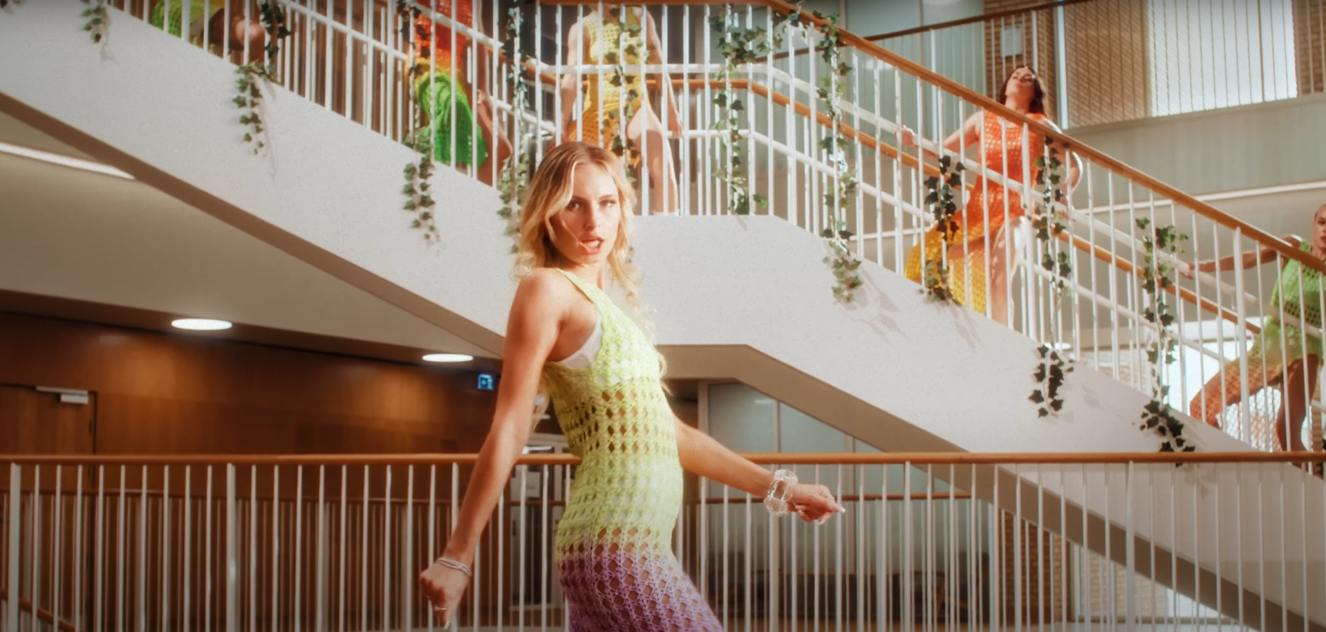 Scene from music video To The Moon by Saint Clara. The singer and her dancers are situated by the central staircase in the Skou Building